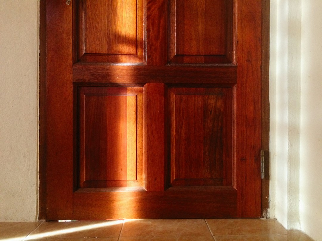 Door repair Toronto: wooden interior door that sticks and rubs against the frame