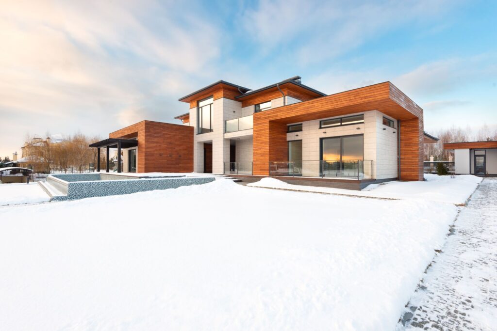 Modern Ontario home in fresh winter snow, weatherproofed for the cold season